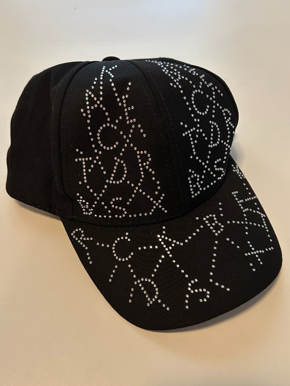 women's hat with silver rhinestones with alphabet design